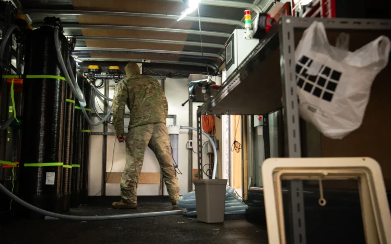 U.S. Air Force Maj. Jeffrey Lewoczko, former 374th Airlift Wing futures director, builds the interior of the base's mobile water filtration trailer at Yokota Air Base, Japan, March 20, 2025. Yokota Airmen built the trailer to remove contaminants from affected locations using a mobile, multi-stage filtration system. (U.S. Air Force photo by Senior Airman Jacob Wood)