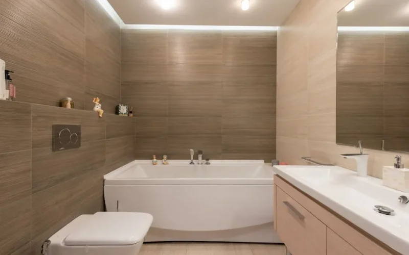 Elegant bathroom featuring modern fixtures and wooden tiles.